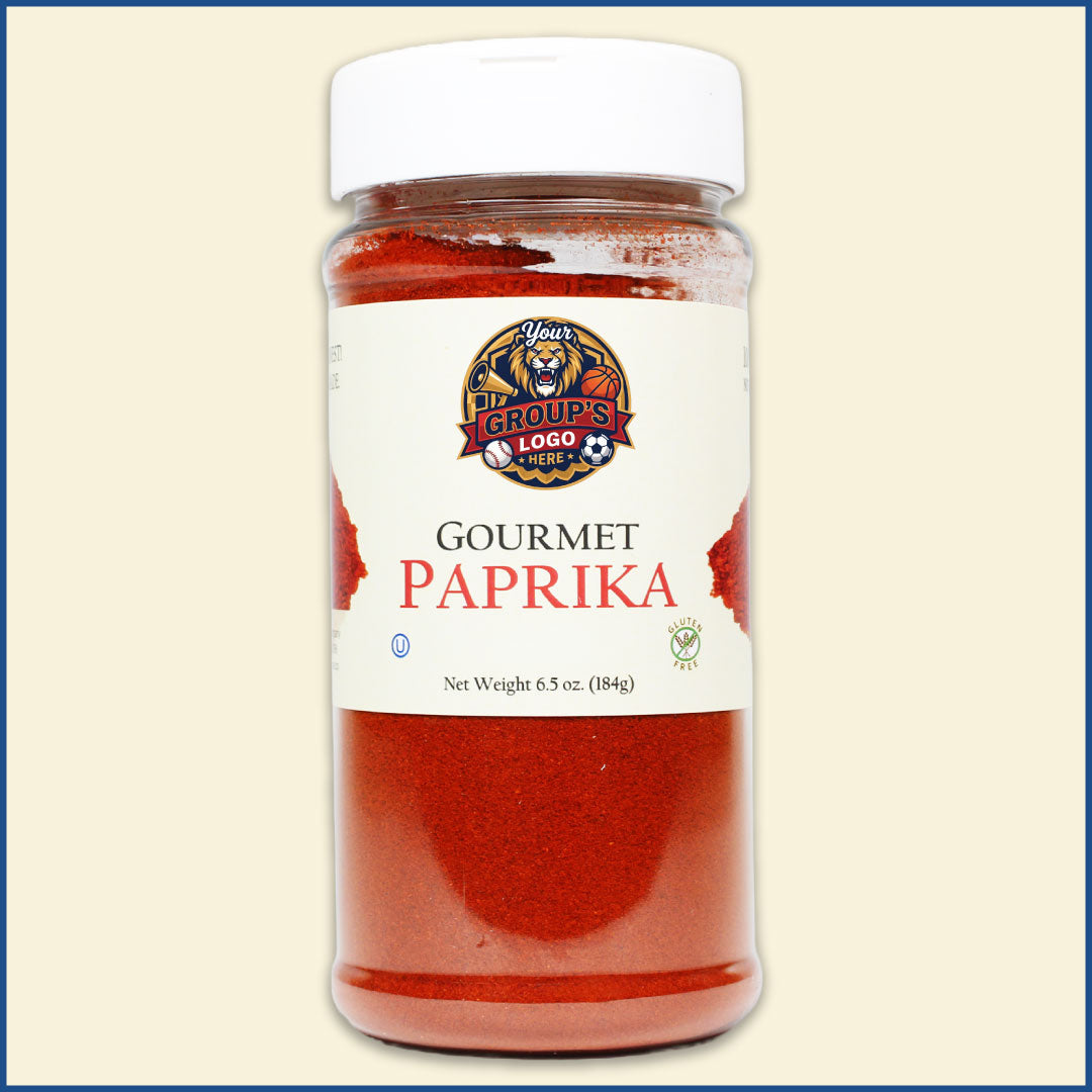 Jar of gourmet paprika with a branded label on a beige background